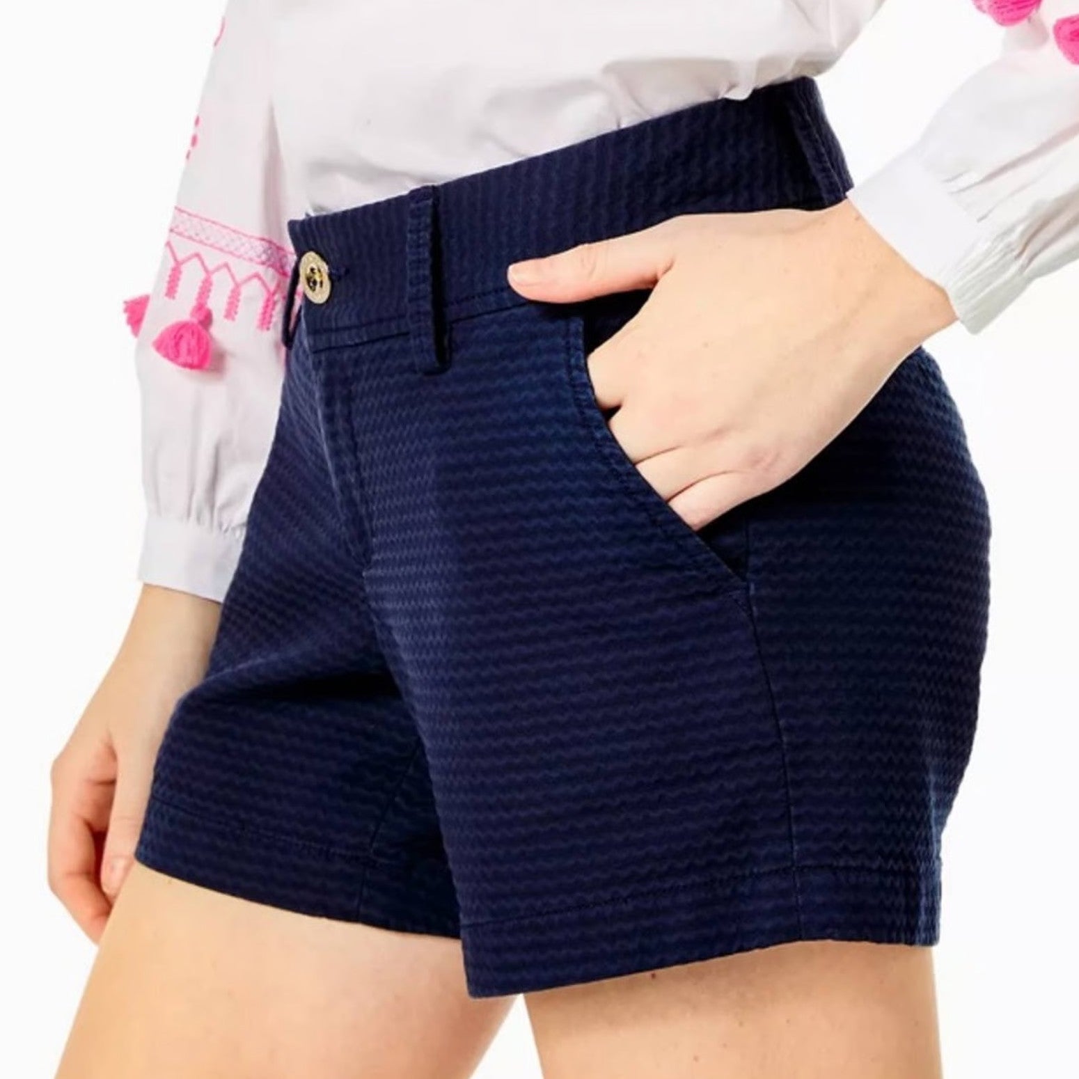 Lilly Pulitzer Navy blue shorts worn by a person on a white background
