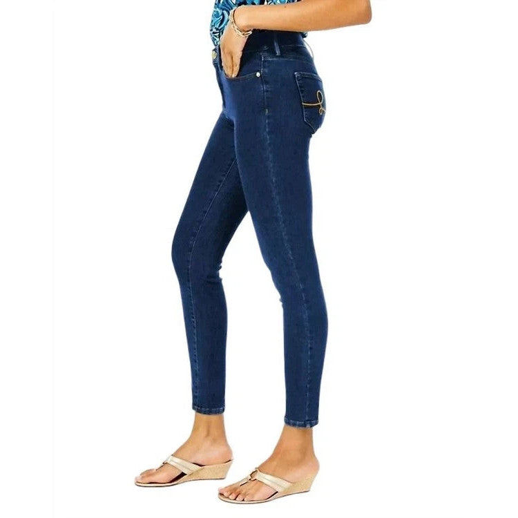 Person wearing blue Lilly Pulitzer jeans on a white background